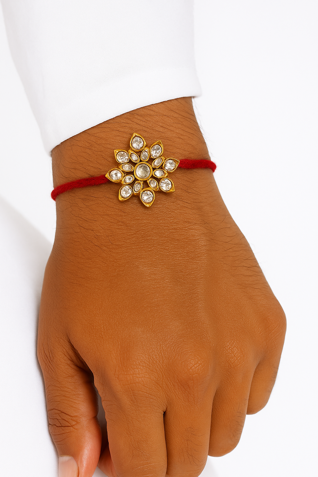 22K Gold Plated Lotus Leaf Kundan Rakhi with White Glass Stones & Red Thread