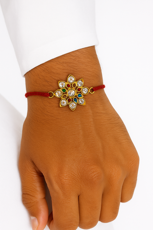 22K Gold Plated Lotus Leaf Kundan Rakhi with White Glass Stones & Red Thread