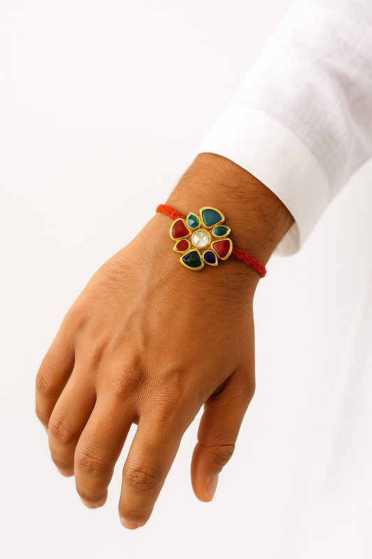 22K Gold Plated Flower Style Kundan Rakhi with White Glass & Shiny Stones Wrapped in Red Thread